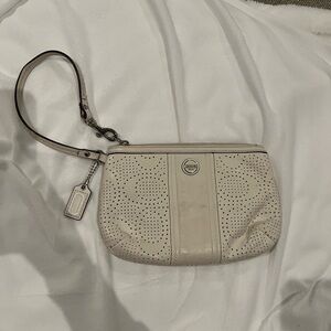 Coach Wristlet- cream leather color, perforated leather